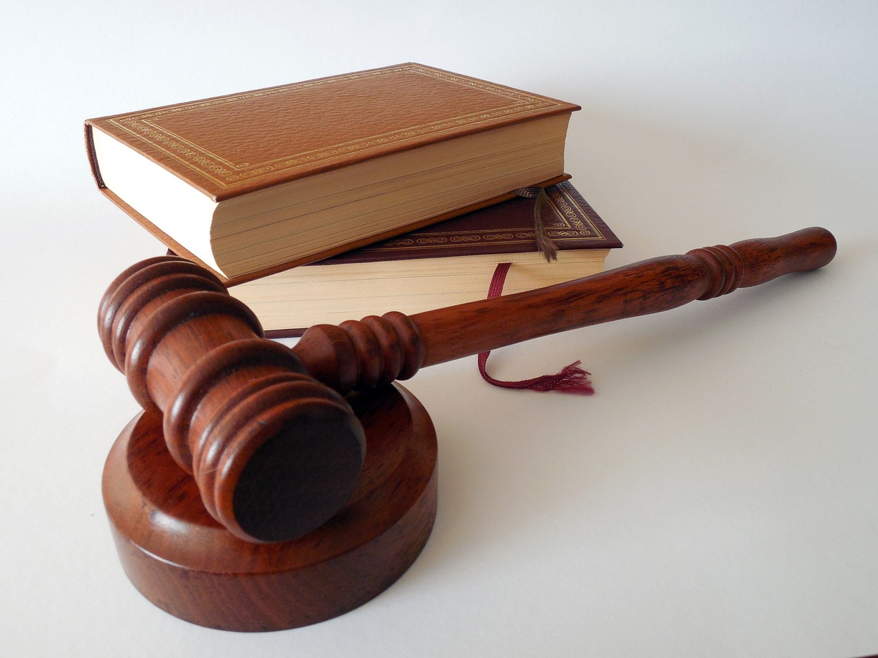 A gavel and law books -representing the ways in which our lawyers practice their craft, with knowledge and experience.